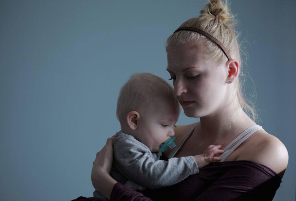 Postpartum mother holding her baby